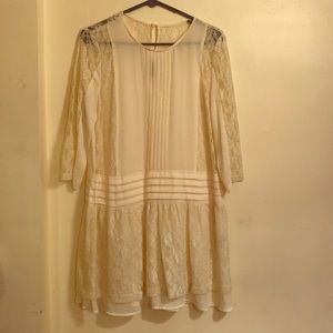 Sheer, cream lace dress.